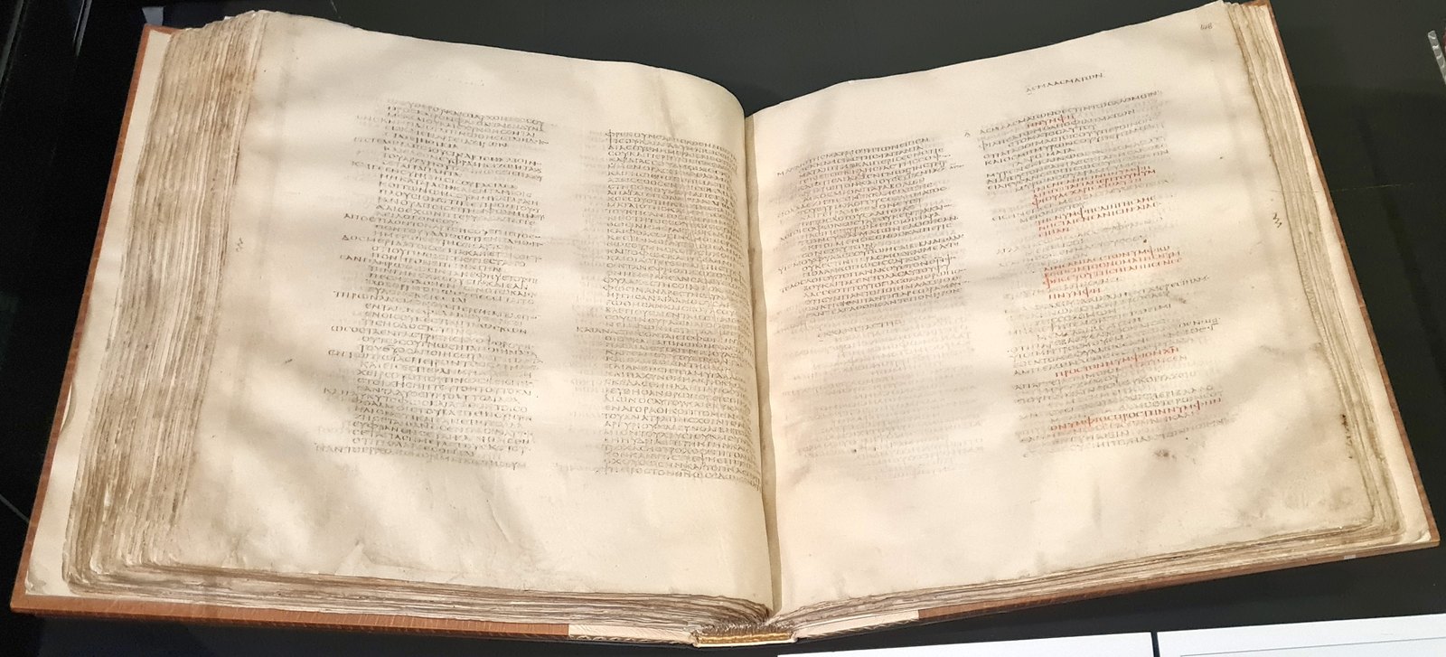 A leaf of Codex Sinaiticus, four columns of Greek on animal skin.